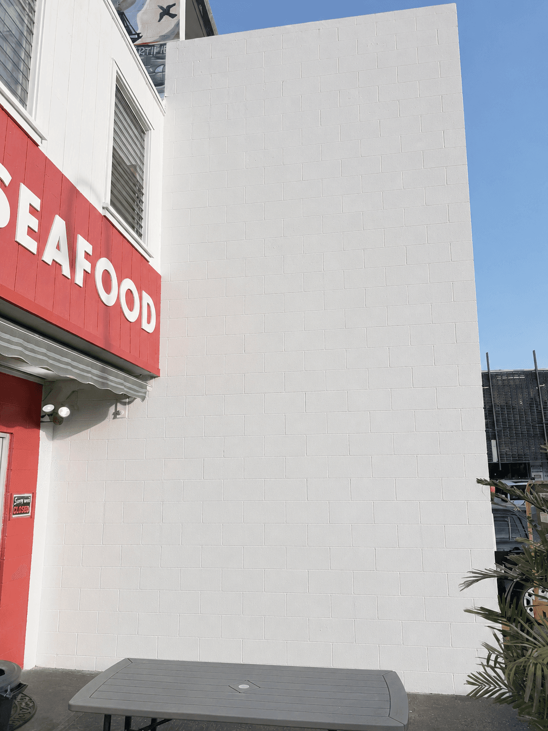 Ono Seafood — blank wall before the mural
